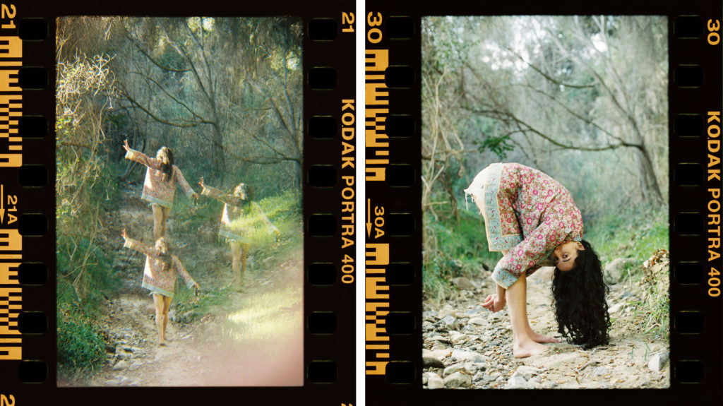 woman playfully walking in a dry creek