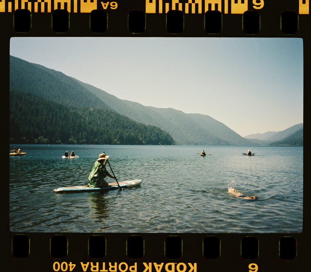 vista scene of big lake with paddleboarders