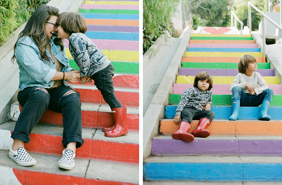 colorful stairs with siblings sitting relaxed and one of mom and son playfully pressing foreheads together