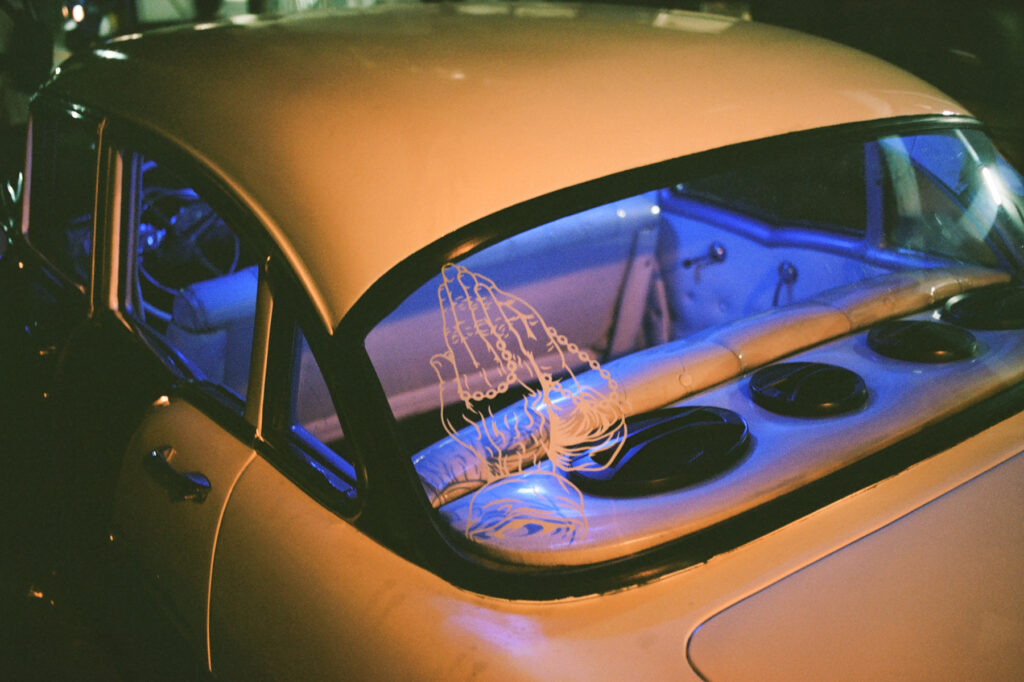 Vintage car with glowing neon interior lighting.