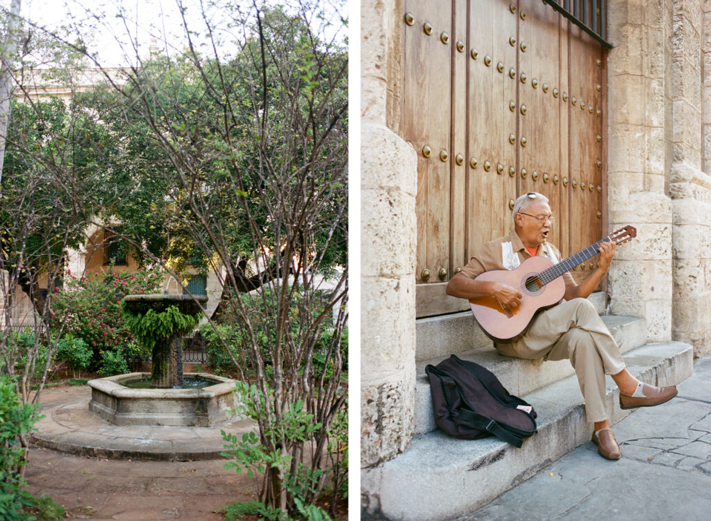 A serene courtyard with trees and a fountain, and an elderly man playing guitar by a large wooden door.