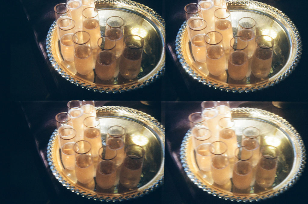 A quadruplicated image showing a tray of champagne flutes.