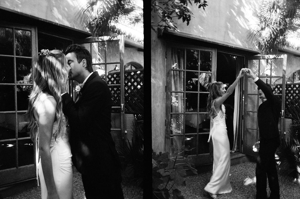 A bride and groom sharing a kiss and dancing at their wedding celebration, captured in black and white.